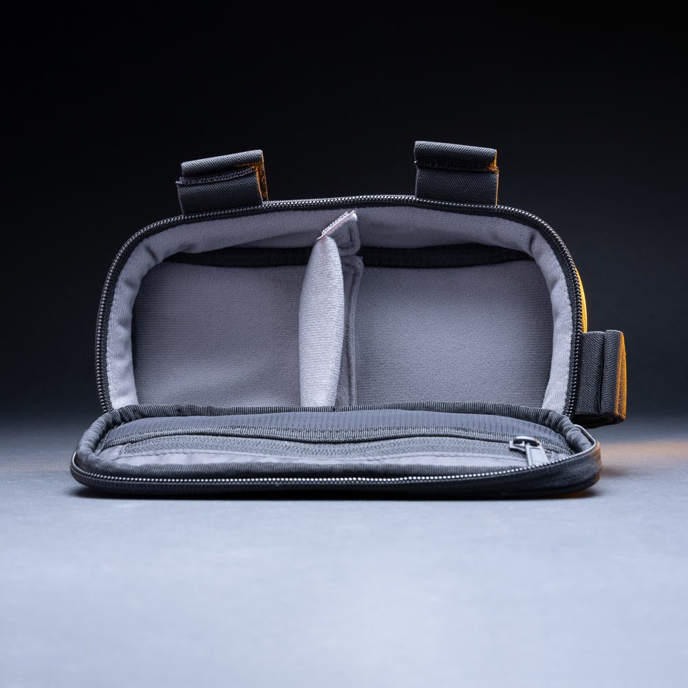 Outbound bike light storage bag open and empty, showing the padded divider