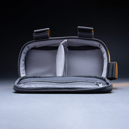 Outbound bike light storage bag open and empty, showing the padded divider