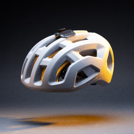 Wide helmet mount base attached to a white vented bike helmet